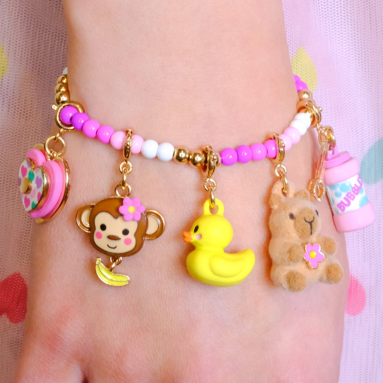 CHARM IT! Pink Charm Bracelet with Assorted Monkey, Heart, Rubber Ducky, Capabara, and Bubbles charms