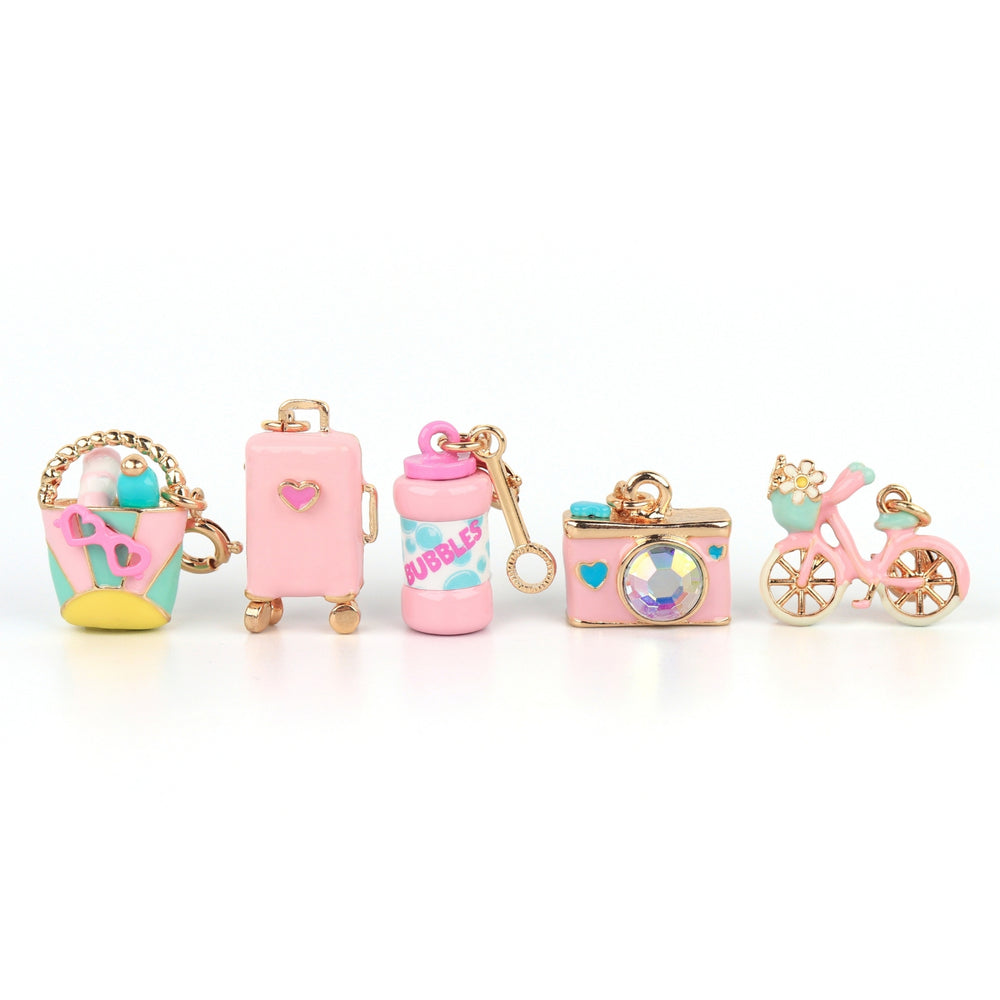 CHARM IT! pink and blue charms including a beach bag, suitcase, bubbles, camera, and bicycle