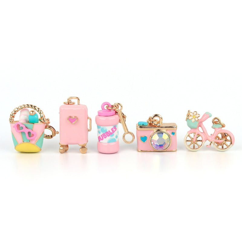 CHARM IT! pink and blue charms including a beach bag, suitcase, bubbles, camera, and bicycle