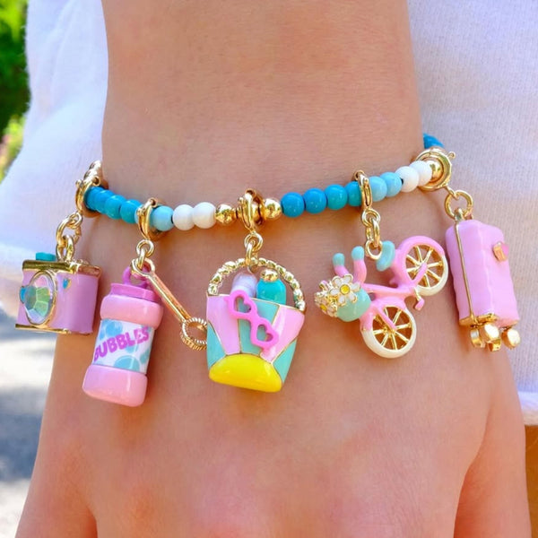 CHARM IT! Vacay All Day Charm Bracelet with Vacation themed charms on an aqau colored bracelet.