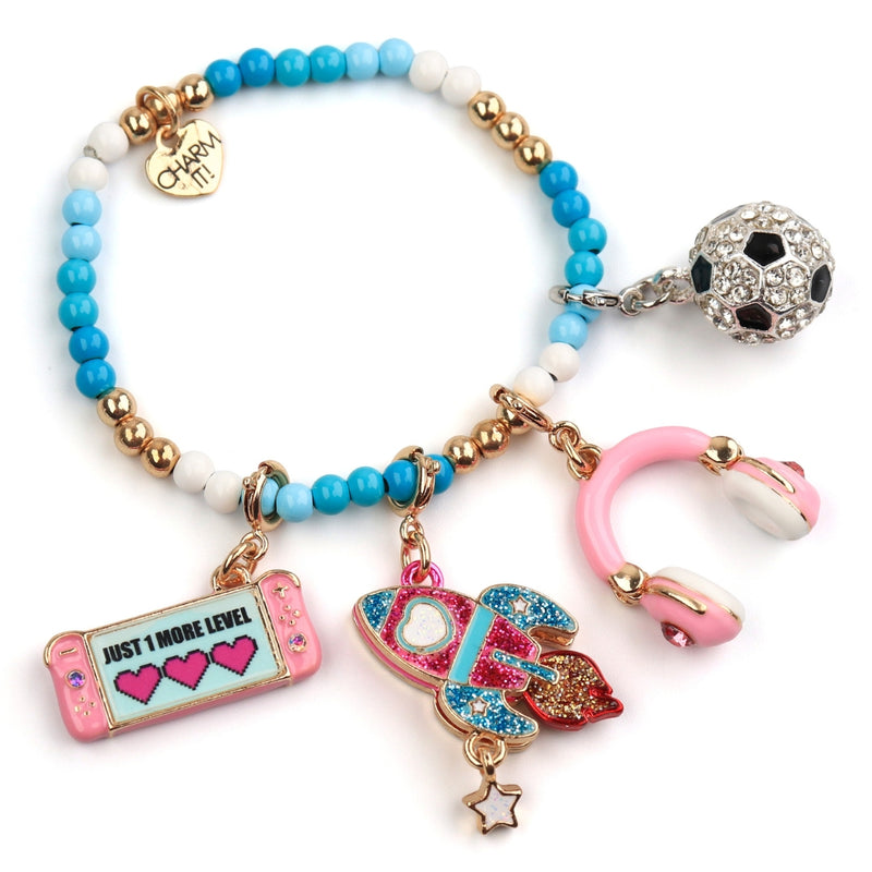 CHARM IT! Beaded Bracelet with soccer ball, gamer girl, rocket, and headphones charms.