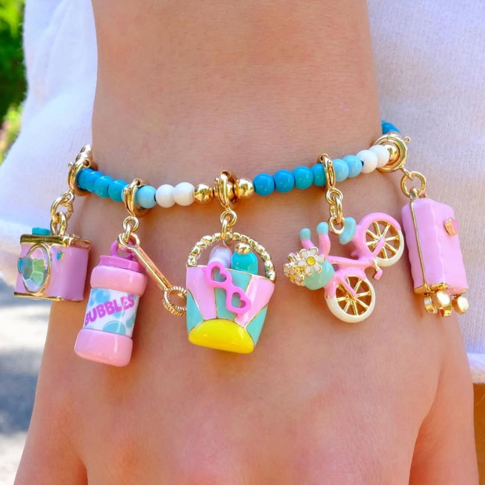 CHARM IT! Vacay All Day Charm Bracelet with Vacation themed charms on an aqau colored bracelet.